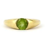 A 9ct yellow gold ring set with a round cut peridot, (T.5).