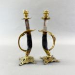 A pair of WWI German Army (Imperial Wurftembere) sword hilt candlesticks.
