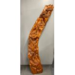 A superb large Chinese carved tusk shaped root wood featuring scholars and musicians, H. 178cm.