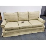 An upholstered three seater settee on castors, L. 98cm.