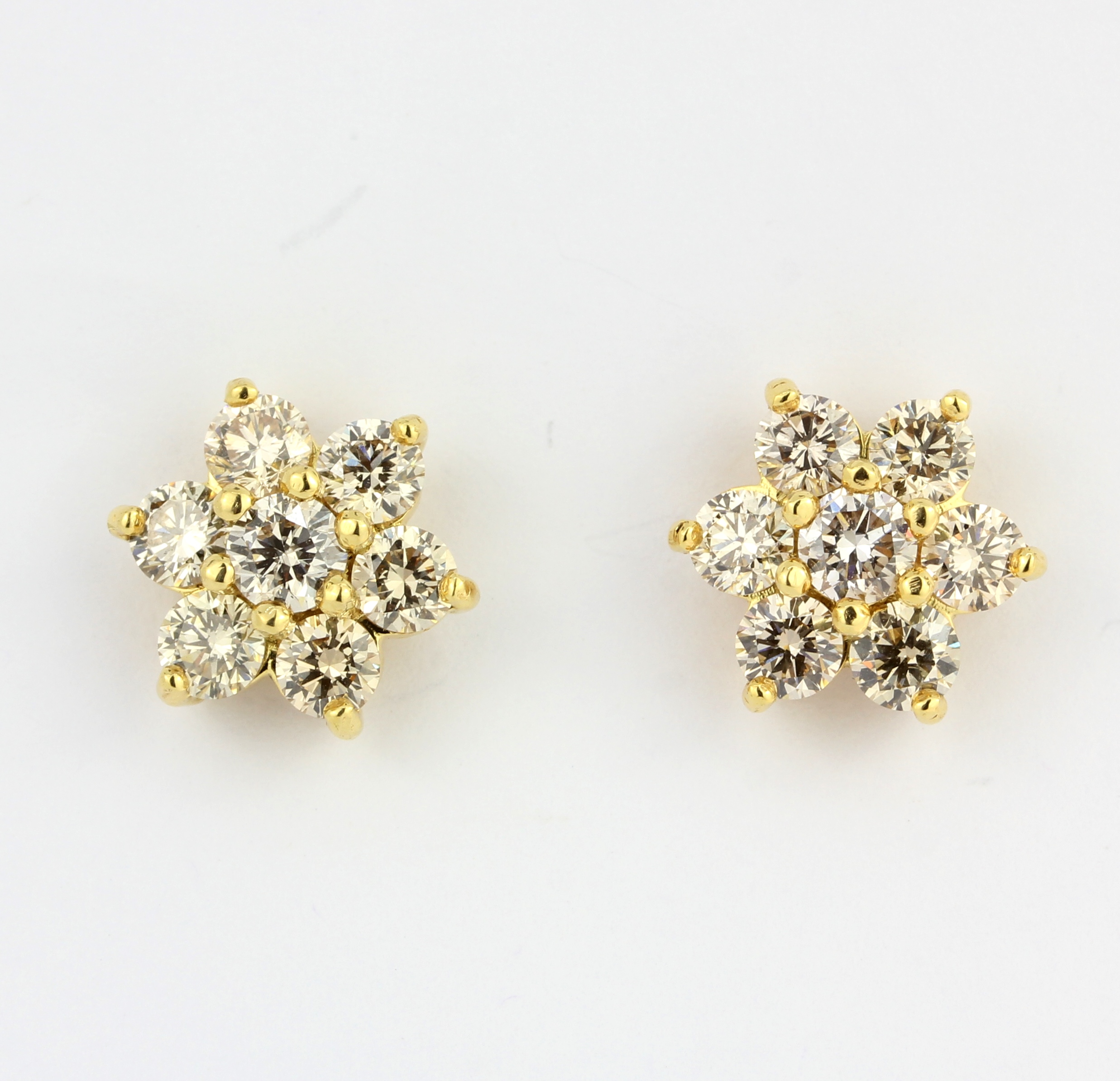 A pair of yellow metal (tested 18ct gold) daisy cluster earrings set with brilliant cut diamonds, - Image 2 of 3