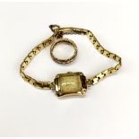 A 9ct gold cased ladies vintage wristwatch and stone set eternity ring. Watch strap gold plated.