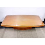 An Art Deco satinwood coffee table with plate glass top.