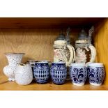 A group of German pottery steins and beakers, with two Jasber German pottery vases.