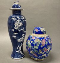 A Chinese Prunus pattern porcelain vase and cover with a hand enamled ginger jar. H 38cm