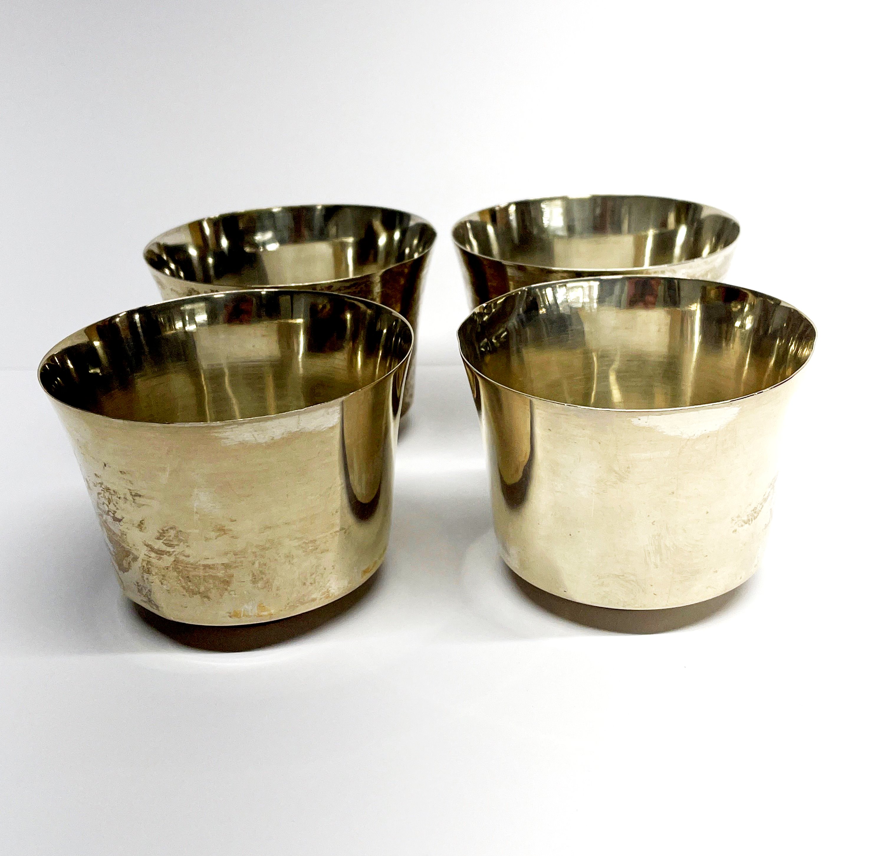 A set of four white metal (tested silver) bowls, Dia. 9cm, H. 6.5cm.