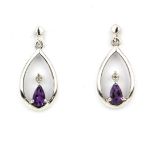 A pair of 925 silver drop earrings set with pear drop amethyst and a brilliant cut diamond, L. 1.