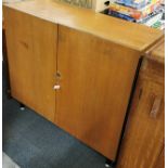 An interesting light oak, metal legged cabinet with drawers inside for filing and a sprung leg for