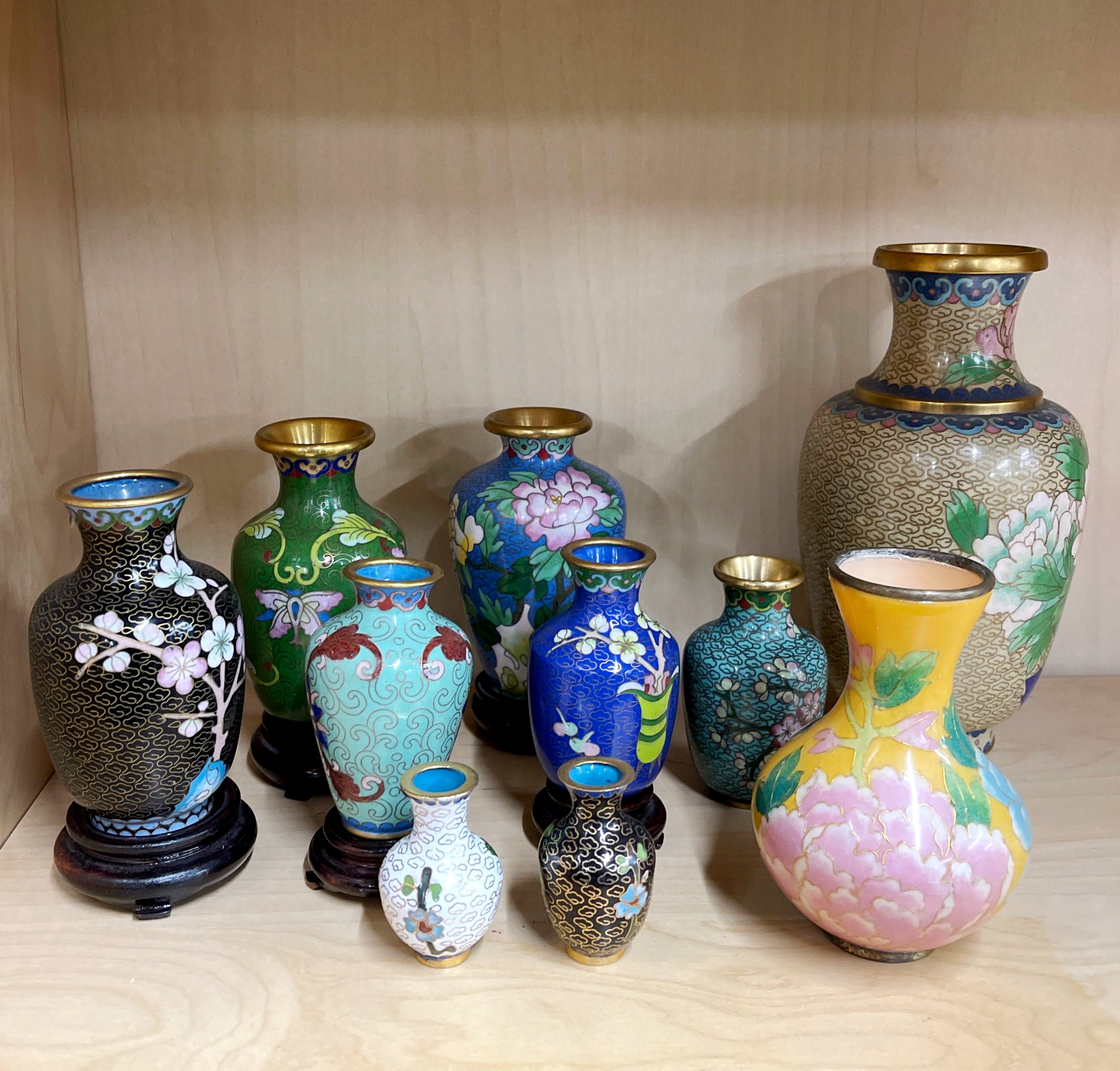 A collection of 9 Chinese cloisonne and one Champleve vases, tallest H. 19cm.