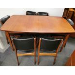 A vintage extendable teak dining table with six teak chairs, 153 x 90cm. Extended L. 206cm.