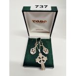 A silver Celtic cross pendant and chain with Celtic Claddagh earrings.