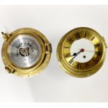 A ships style brass wall clock and a porthole style barometer without glass, Dia. 22cm.