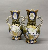 A pair of Continental Majolica style porcelain vases, H. 27cm.