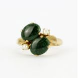 A 14ct yellow gold (stamped 14k) jade and pearl set ring, (R).