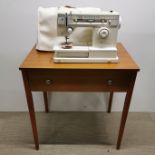 A 'Magic' Singer electric sewing machine table, 79 x 73 x 50cm.