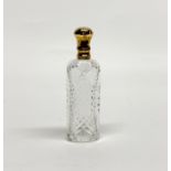 A very fine antique cut glass perfume bottle with a contintental hallmarked 18ct gold lid, H. 9.