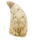 Ø A 19TH CENTURY SCRIMSHAW DECORATED WHALE'S TOOTH