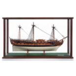 A FINELY CARVED AND PRESENTED 1:48 SCALE MODEL OF H.M.S. WAGER [1734]