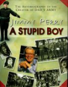 Jimmy Perry signed hardback book titled A Stupid Boy signature on the inside title page. Good