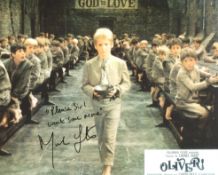 Oliver! Movie photo signed by Mark Lester who has also added the legendary 'more please' quote,