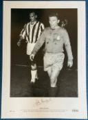 John Charles signed 23x17 black and white print pictured leaving the pitch with Ferenc Puskas in