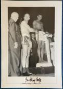 Sir Henry Cooper signed 20x14 black and white print pictured at the weigh in before his fight with