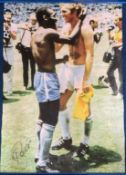 Pele signed 34x24 canvas print picturing the iconic moment with Bobby Moore after Brazil and