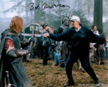 Bob Anderson Handsigned 10x8 Colour Photo of himself practicing sword fighting during a film set.