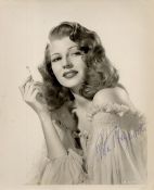 Rita Hayworth signed 10x8 sepia photo. Rita Hayworth (born Margarita Carmen Cansino; October 17,