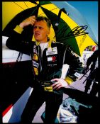 F1. Johnny Herbert Handsigned 10x8 Colour Photo. Photo shows Herbert in black racing suit protecting