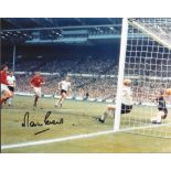 Football. Martin Peters Signed 10x8 colour photo. Photo shows the Peters watching to see if