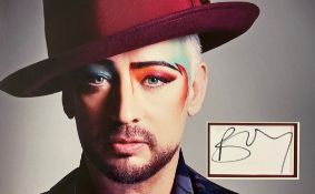 Music, Boy George signed presentation photograph featuring a colour photograph board, approx 12x18