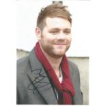 Singer Brian McFadden signed 12x8 colour photo in excellent condition. Brian Nicholas McFadden is an