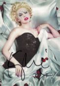 Kylie Minogue signed 6 x 4 inch colour postcard. Good condition. All autographs come with a