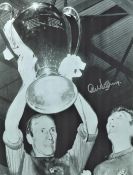 Football Alex Stepney signed 16x12 black and white photo pictured after Manchester Uniteds win in
