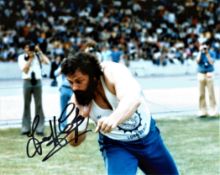 Athletics Geoff Capes 10x8 Signed B/W Photo Pictured In Shot Putt Action. Good condition. All
