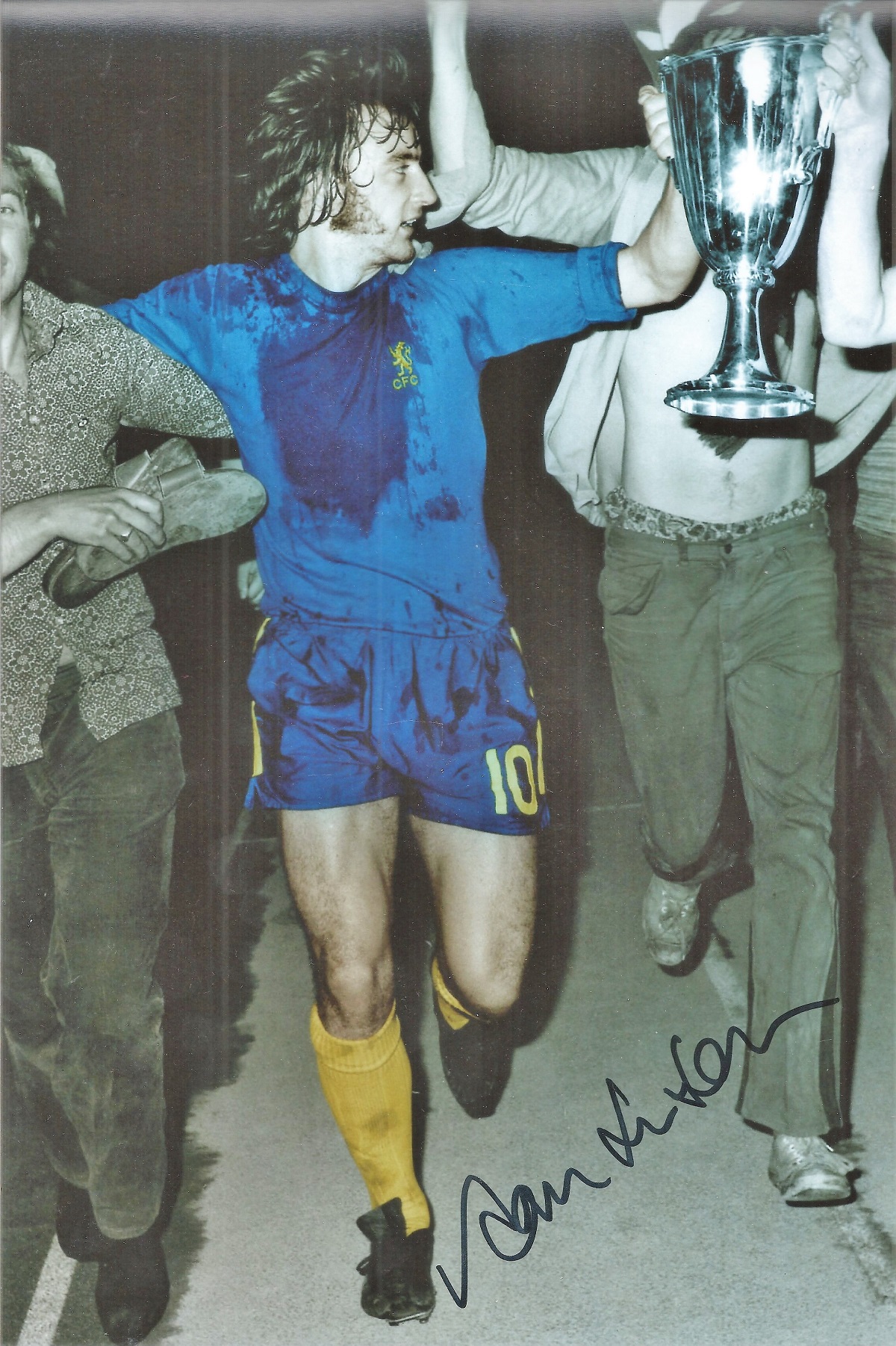 Chelsea Legend Ian St John Signed Colourised 10x8 Photo showing St John Celebrating with a trophy