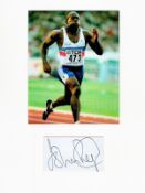 Athletics John Regis 16x12 overall mounted signature piece. Good condition. All autographs come with