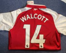 Theo Walcott Hand signed Puma Arsenal Shirt. Number 14 Walcott on the rear. Signed in black marker