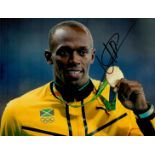 Athletics Legend Usain Bolt Hand signed 10x8 Colour Photo showing bolt proudly showing off his