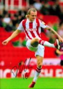 Stoke City Defender Ben Wilmot Hand signed 10x8 Colour Photo showing Wilmot kicking the ball. Good