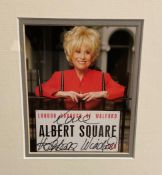 Barbara Winsor (Peggy Mitchell) Hand signed 5x4 Colour Photo in brown wooden Frame measuring 13.