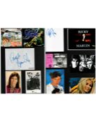 Music collection of over 30 signed items including CD covers, pages, photographs and promo cards.