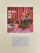 JOHN BARRY (1933-2011) signed card Overmounted beneath John Barry Plays 007 Photo. Overall size