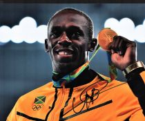Olympics, Usain Bolt signed 10x8 colour photograph. Jamaican sprinter, widely considered to be the