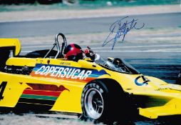 Motor Racing, Emerson Fittipaldi signed 12x8 colour photograph pictured in action driving