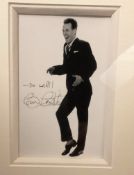 TV Legend Bruce Forsyth Hand signed 6x4 Black and White photo set within a 13x10. 5 black wooden