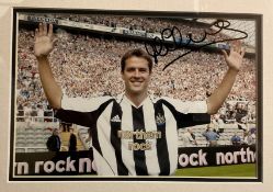 Michael Owen Hand signed 10x7 Colour Photo in black wooden frame measuring 17x14 overall. Photo