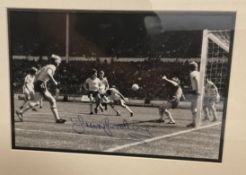 Sir Trevor Brooking Hand signed 12x8 Black and White Photo in Black Wooden Frame measuring 16x17