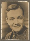 Bobby Howes Signed 7 x 5 inch sepia photo mounted to card, faint autograph rh bottom. Condition 4/